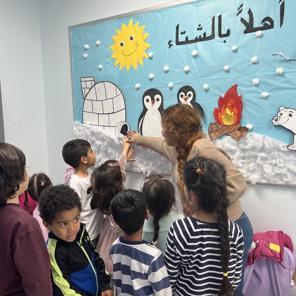 A group of young Arabeez students at the classroom wall display